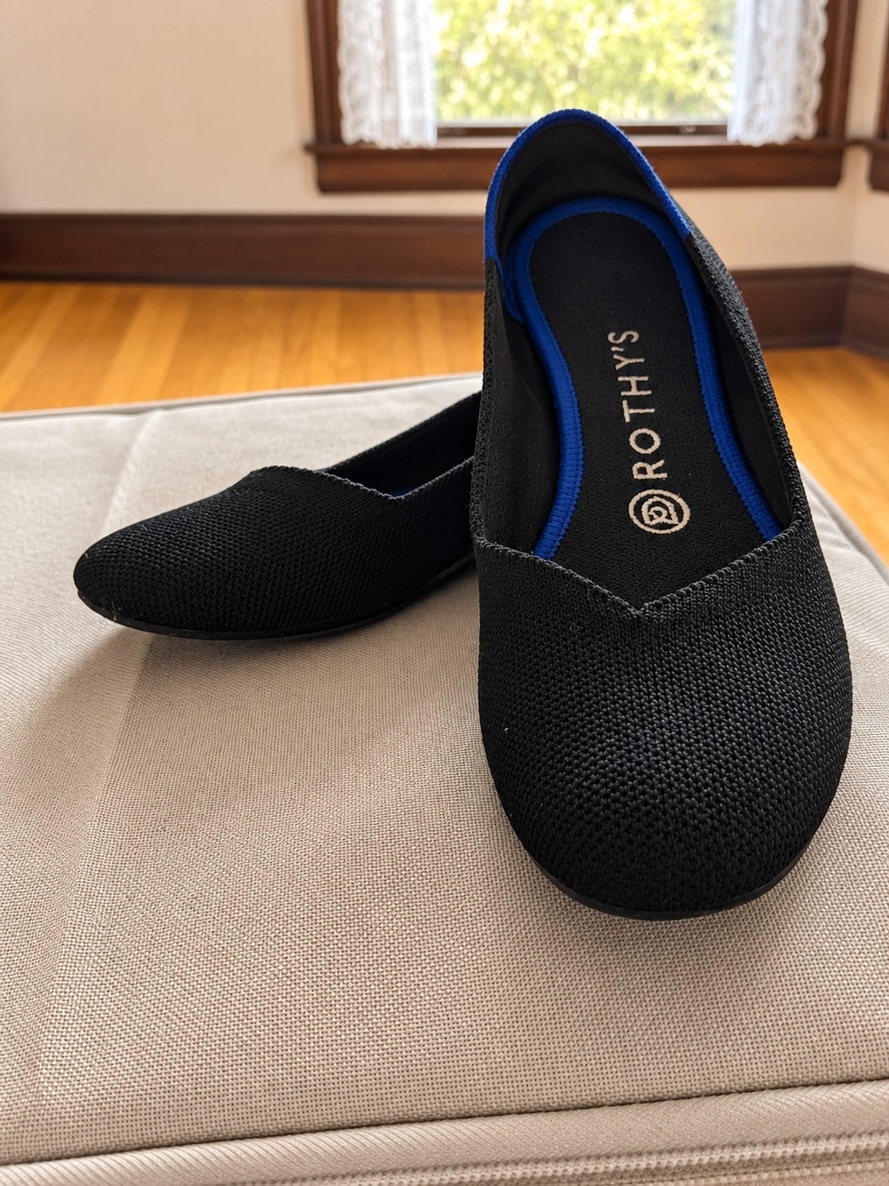 Rothy's Black Knit Pointed Ballet Flat with Blue Trim